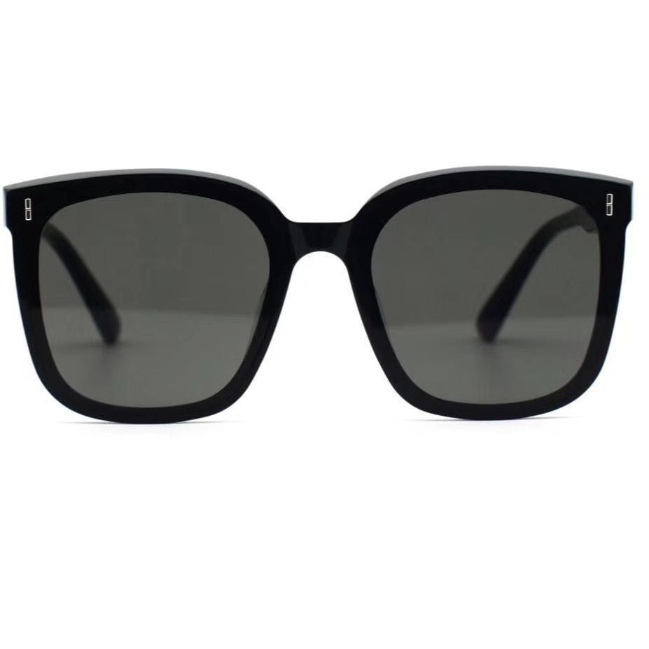 Mens And Womens Trendy Instagram-style Sunglasses with sleek black frame and gray lenses.