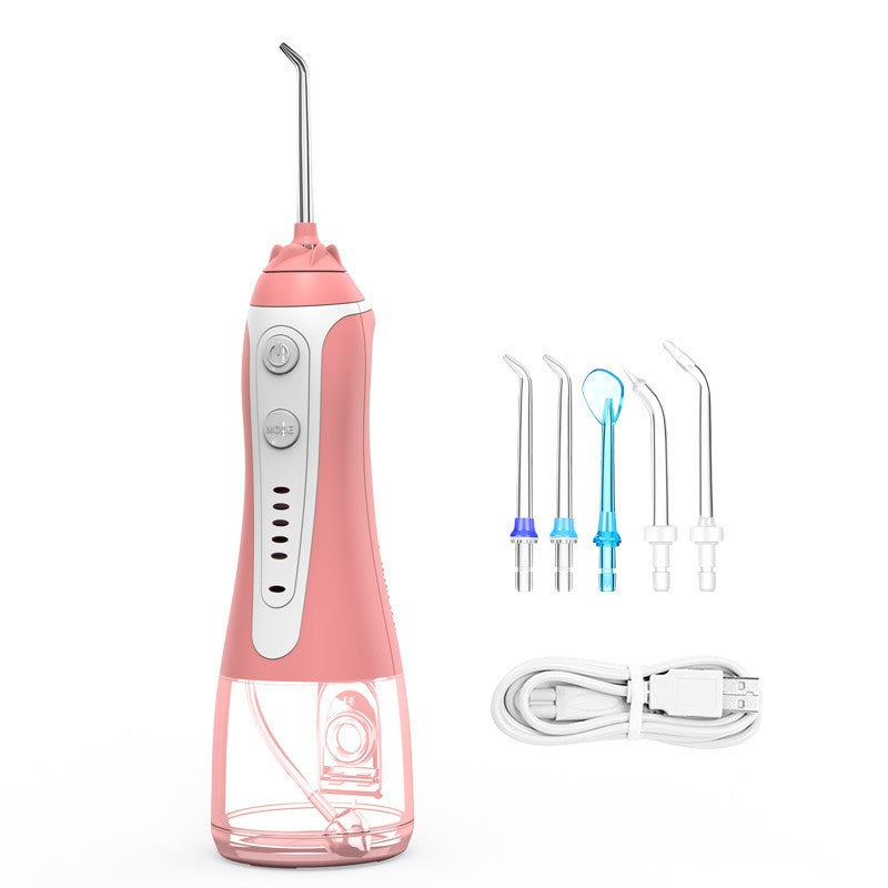 H2ofloss portable water flosser in pink with multiple nozzles and charging cable