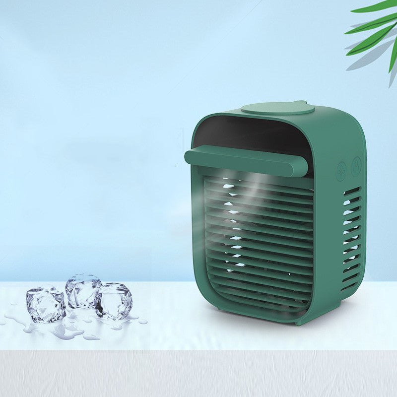 Desktop air conditioner fan with water spray in sleek green design with cooling mist.