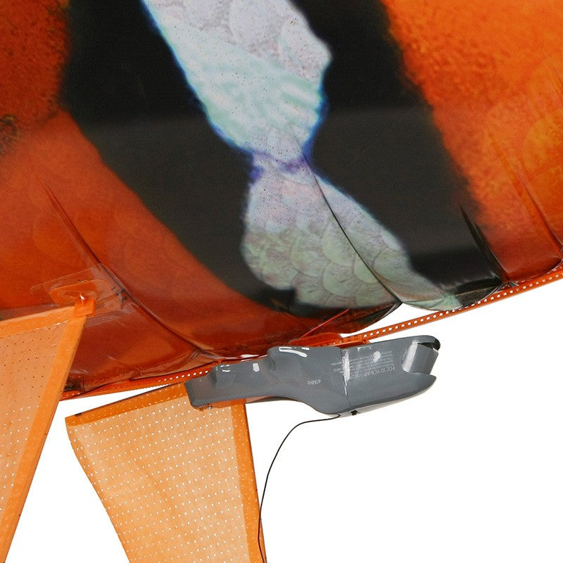 Remote control shark toy underbelly view, showcasing the fins and battery compartment for infrared flying.