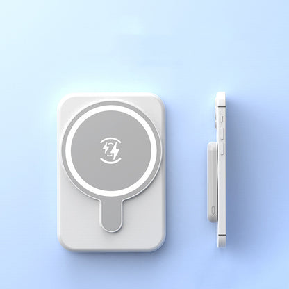 Mini Magnetic Power Bank 5000mAh Wireless on a light blue background next to an iPhone.