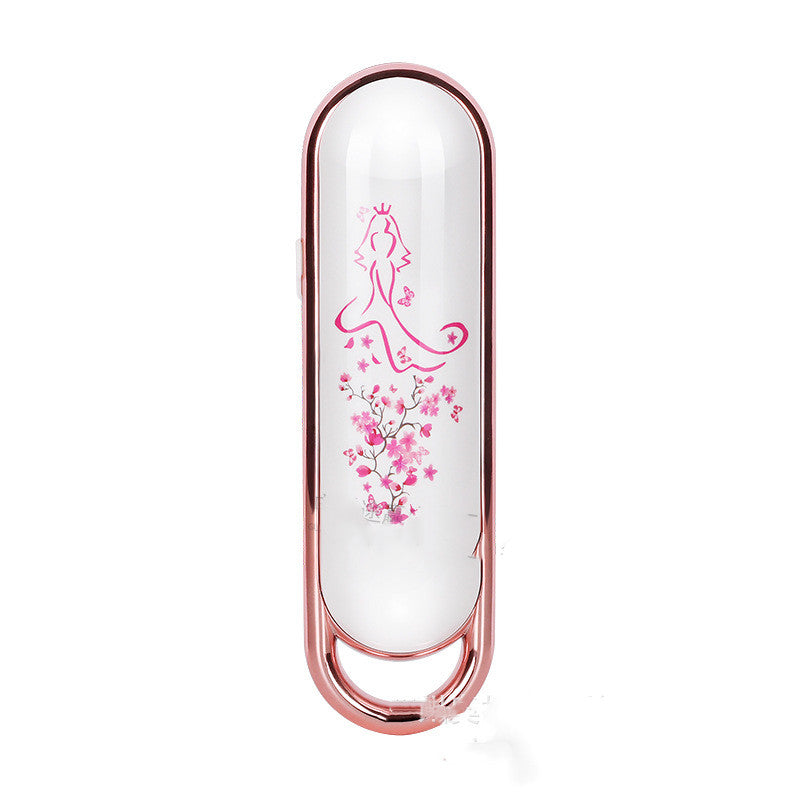 Electric skin firming beauty instrument featuring an elegant design with floral patterns.