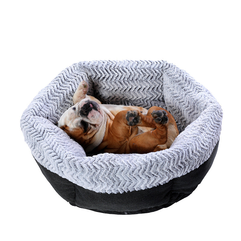 Bulldog sleeping comfortably in a cozy hexagonal doghouse for pets.