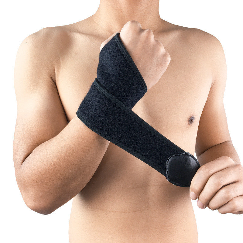 Adult male wearing a black neoprene basketball wristband neoprene on his wrist for sports activities.