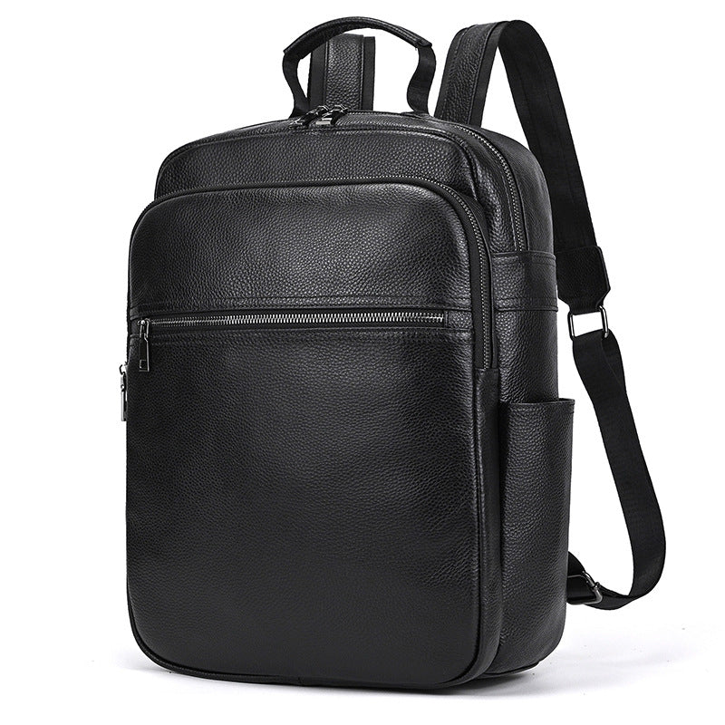 Men's genuine leather commuter backpack in solid black color with curved shoulder straps and multiple compartments.