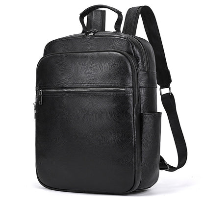 Men's genuine leather commuter backpack in solid black color with curved shoulder straps and multiple compartments.