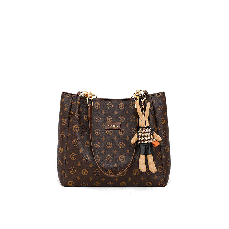 large-capacity women's commuter bag in brown synthetic leather with charm