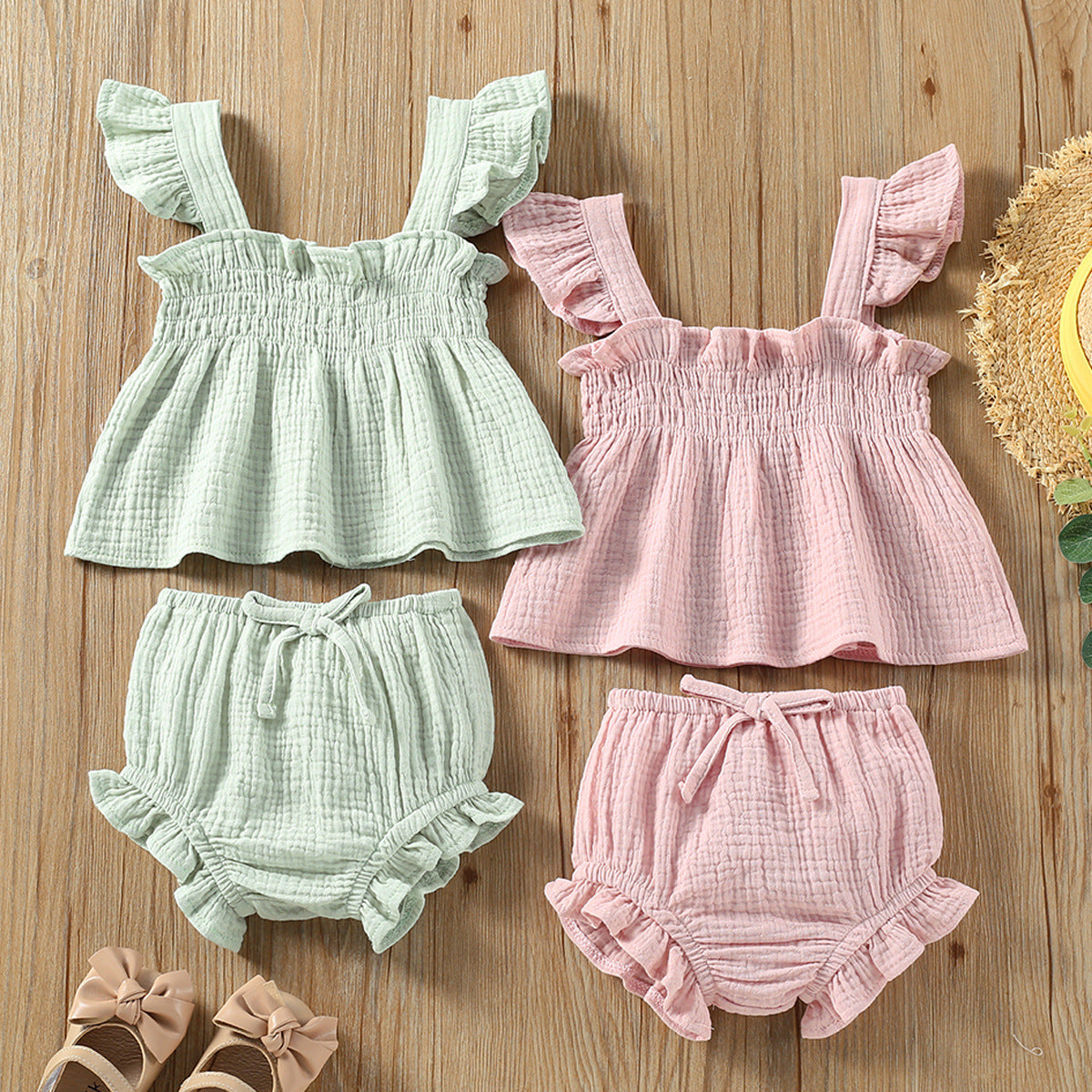 Girls' Solid Color Sling Top Shorts Set in green and pink, featuring sleeveless tops and matching hot pants.