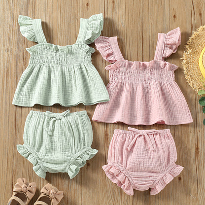 Girls' Solid Color Sling Top Shorts Set in green and pink, featuring sleeveless tops and matching hot pants.
