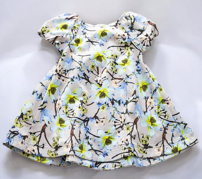 toddler girls floral smock dress with puff sleeves and an A-line silhouette in floral patterns.
