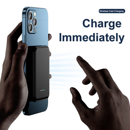 Mini Magnetic Power Bank 5000mAh Wireless attached to a smartphone for immediate charging.