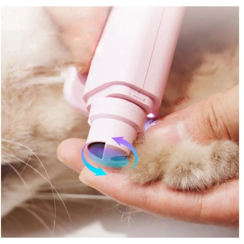 White pet nail trimmer with light being used on a cat's paw for safe nail trimming.