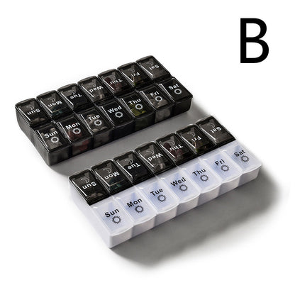 Black and white large capacity detachable pill box for storing seven-day pills.