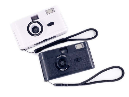 Non-disposable retro film camera in white and black colors, showcasing design and features of 35mm film camera.