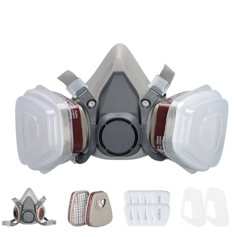 Reusable gas mask for spray painting with dual filters, designed for safety in various work environments.