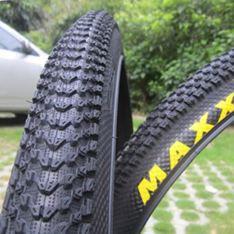 ultralight puncture proof mountain bike tire showcasing tread and design in outdoor setting.