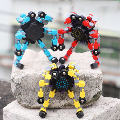 Deformed fidget spinner toys for children in colorful designs on a stone surface.
