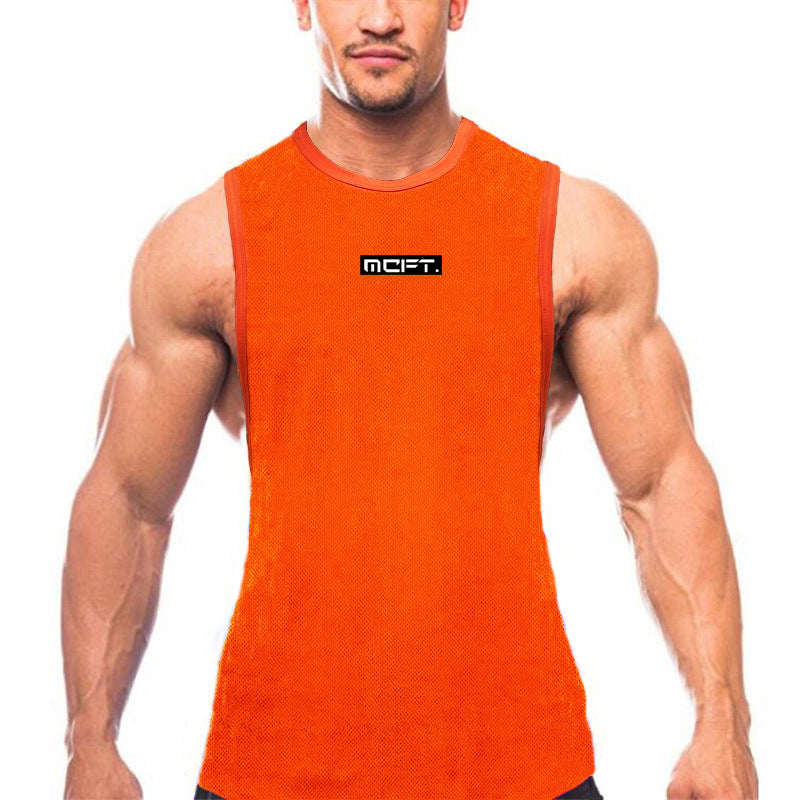 Men's summer sports t-shirt in bright orange worn by muscular man in a fitness setting.