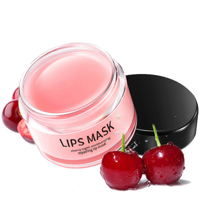 Moisturizing lip care products in a cherry-flavored lip mask jar, promoting hydration and skin nourishment.