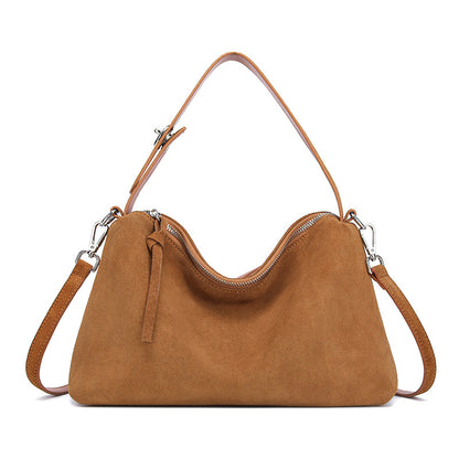 Genuine suede leather tote bag in caramel color with dual shoulder straps and a zip closure.