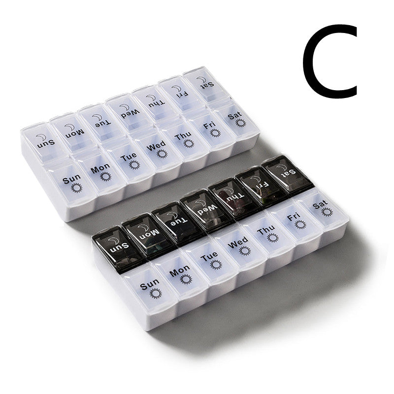 Large capacity detachable pill box in black and white for organizing seven-day pills.