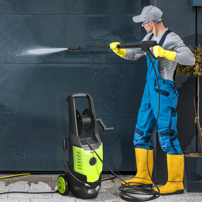 Portable electric pressure washer 2200W in action, cleaning a surface with high pressure water jet.