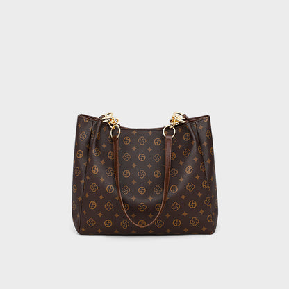 Large-capacity women's commuter bag in synthetic leather with gold accents and large interior for everyday use.