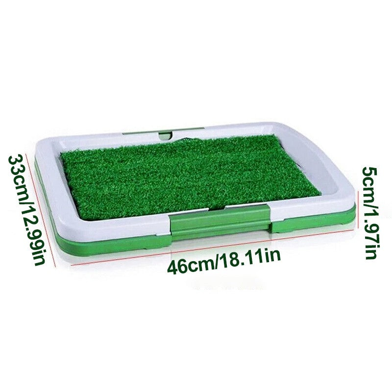 Splash proof puppy potty pad with green synthetic grass and durable plastic tray for indoor dog training.