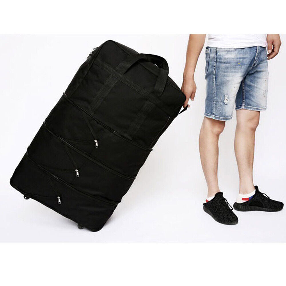 Extra large lightweight travel suitcase being carried by a person, showcasing its durable design and spacious capacity.