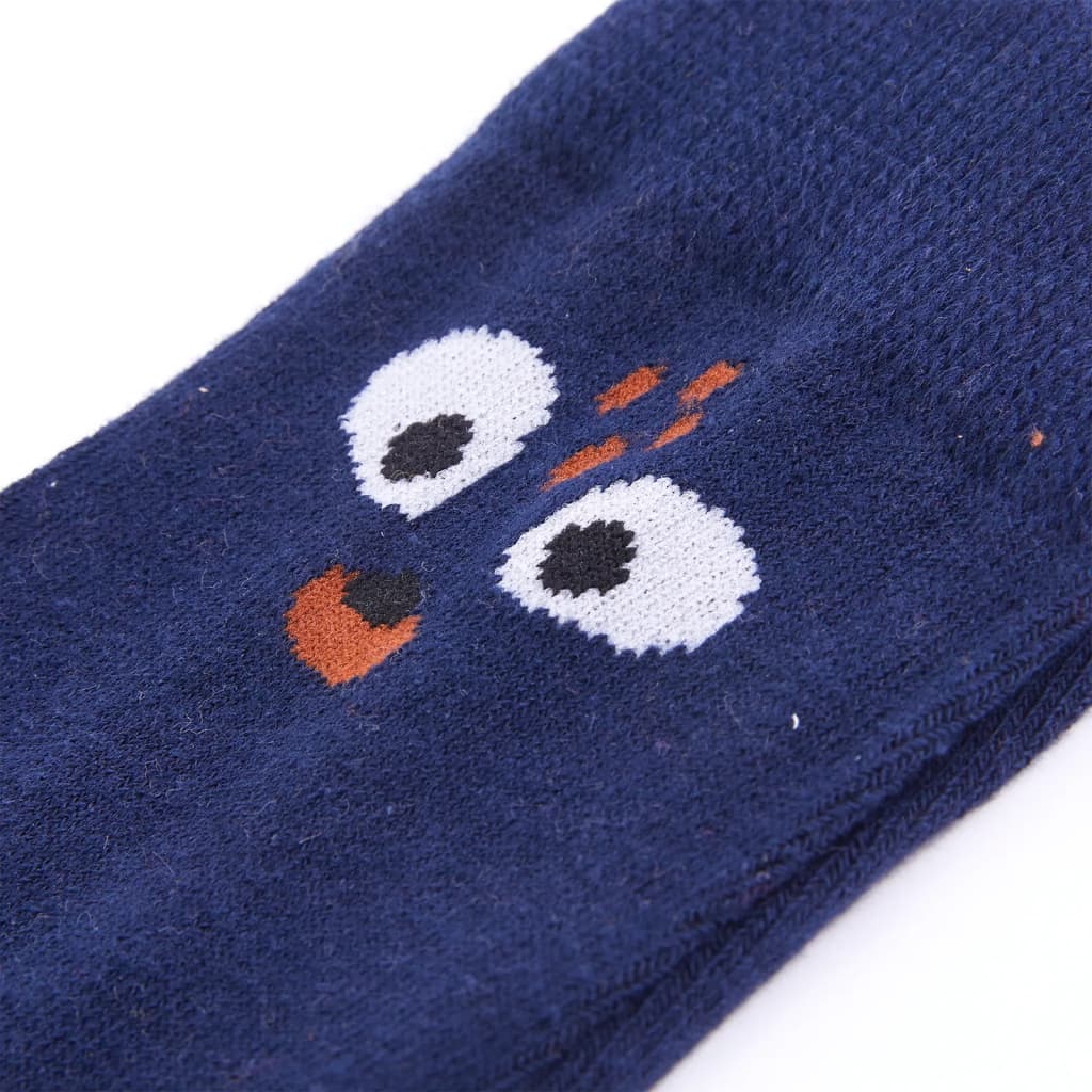 Children's socks EU size 26-29 featuring a cute design with cartoon eyes on a navy background.