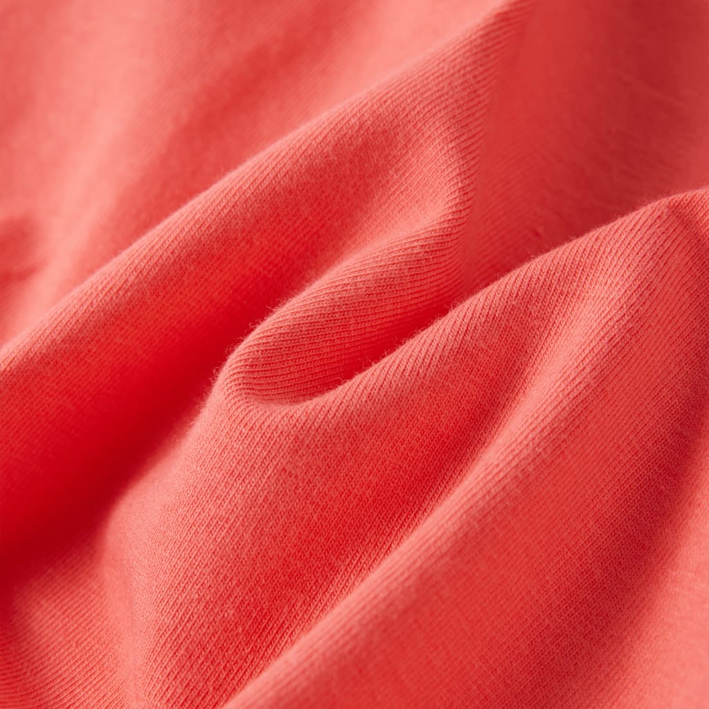 Coral pink children's T-shirt fabric texture close-up, showcasing its softness and quality.