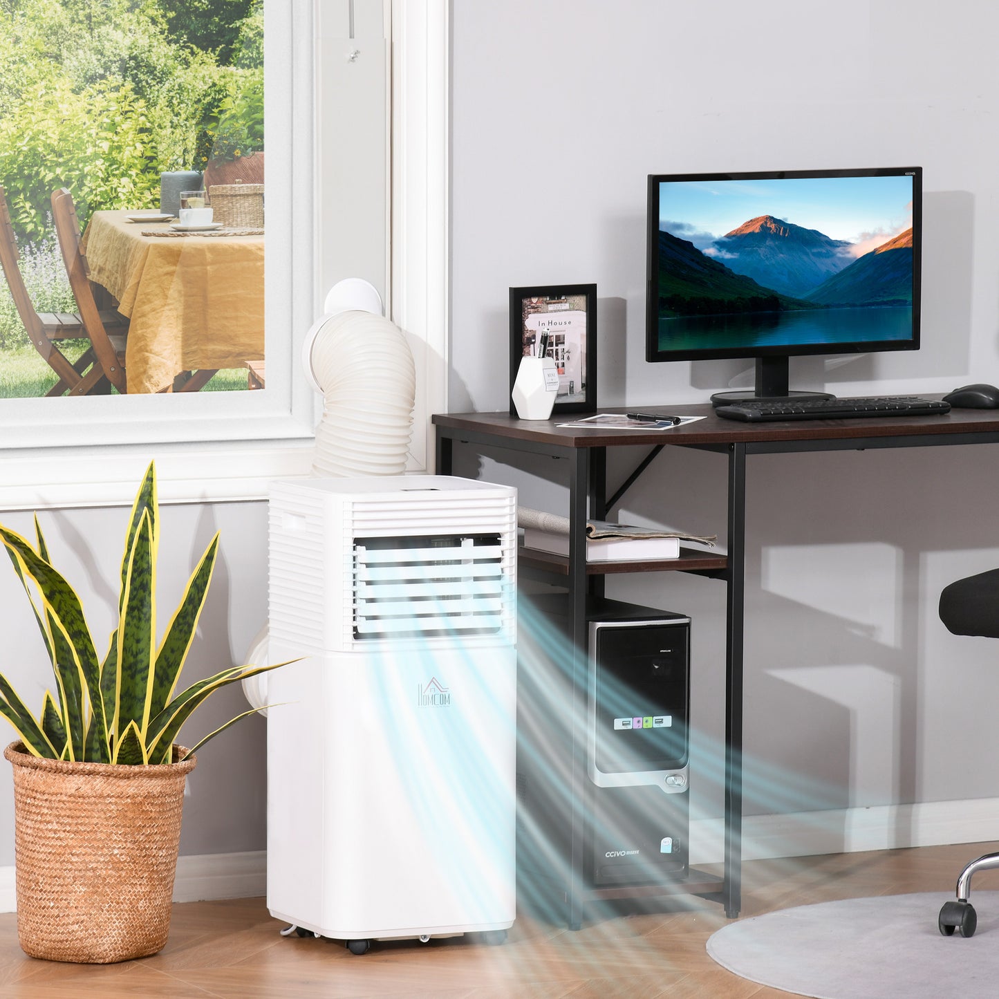 8000 BTU portable air conditioner cooling in home office with plants and computer setup.