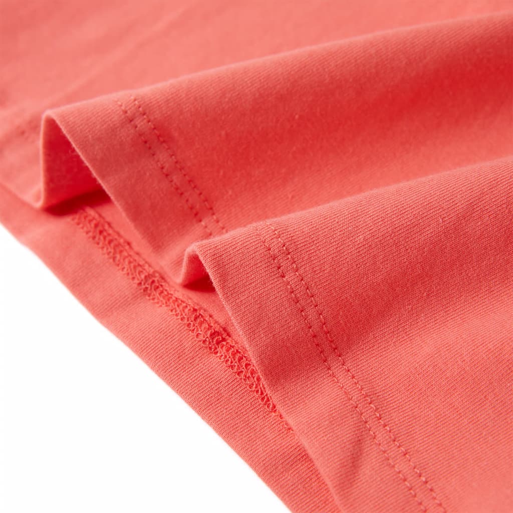 Close-up of coral pink children's T-shirt fabric showcasing its softness and quality for ages 1.5 to 10 years.