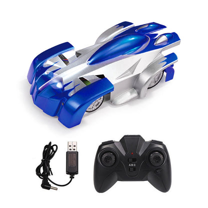Wall climbing remote control car in blue and silver with remote and USB charger.