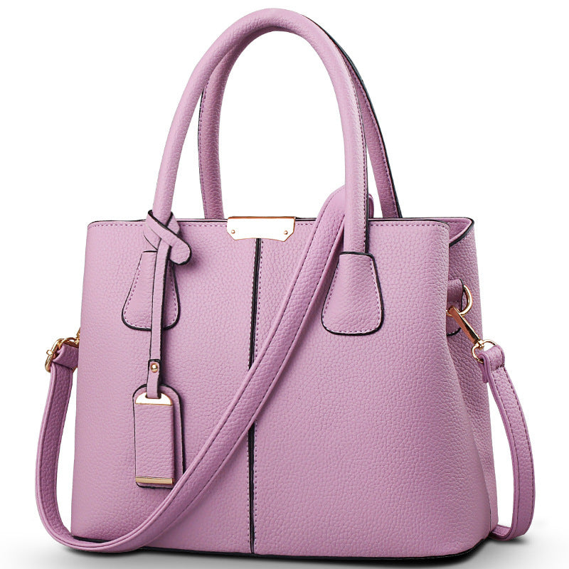 Women's large capacity tote bag in stylish purple with adjustable strap and elegant design for casual daily use.