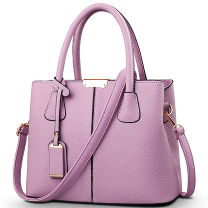 Women's large capacity tote bag in stylish purple with adjustable strap and elegant design for casual daily use.