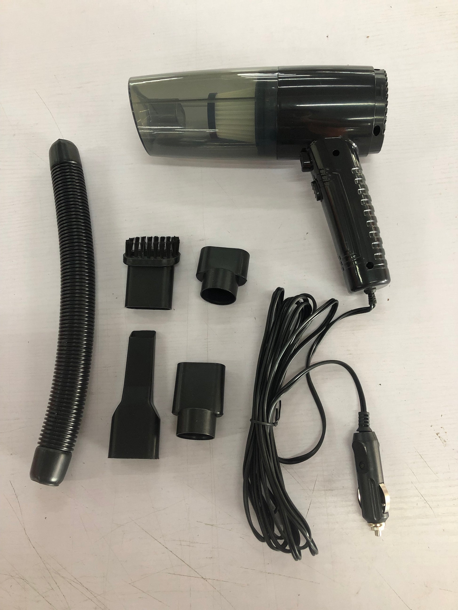 Powerful mini car vacuum cleaner with accessories, designed for dual use in car and home.