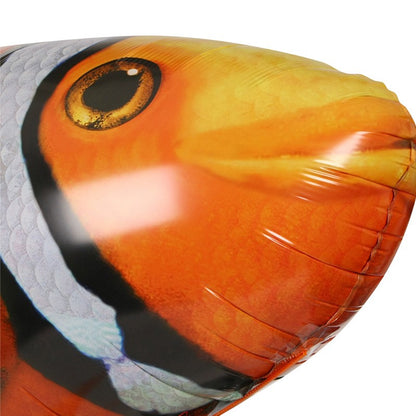 Close-up of a colorful inflatable fish, resembling a clownfish, showcasing vibrant orange and black details.