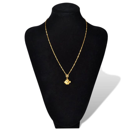 Flannel jewelry bust display showcasing a gold necklace with a floral pendant.