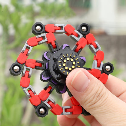 Deformed fidget spinner toys for children in a hand, showcasing unique chain design and smooth rotation.
