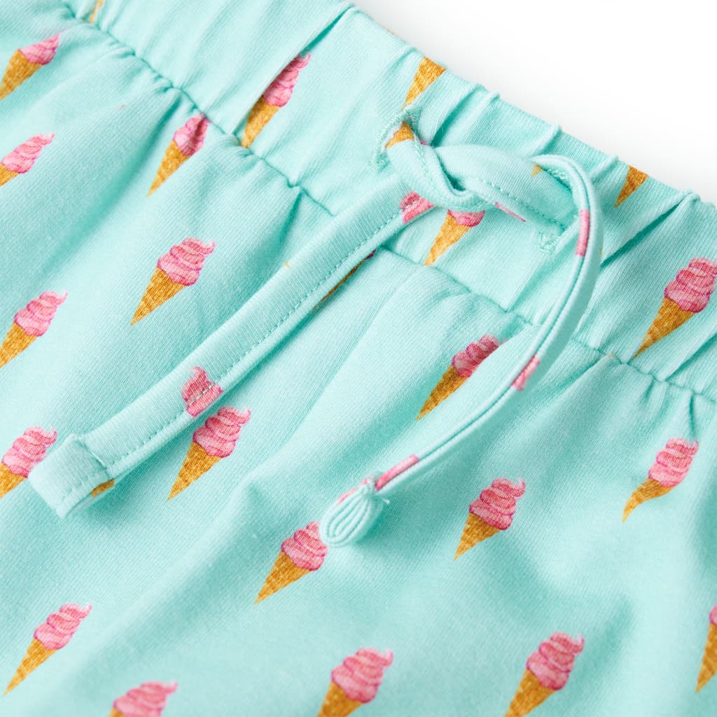 light mint green children's shorts with ice cream print and drawstring detail.