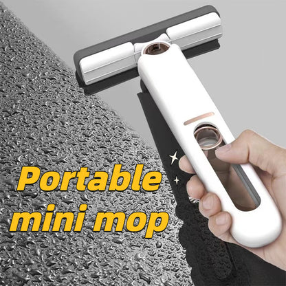 portable self-squeezing mini mop cleaning glass surface with a hand grip, perfect for home and on-the-go use.