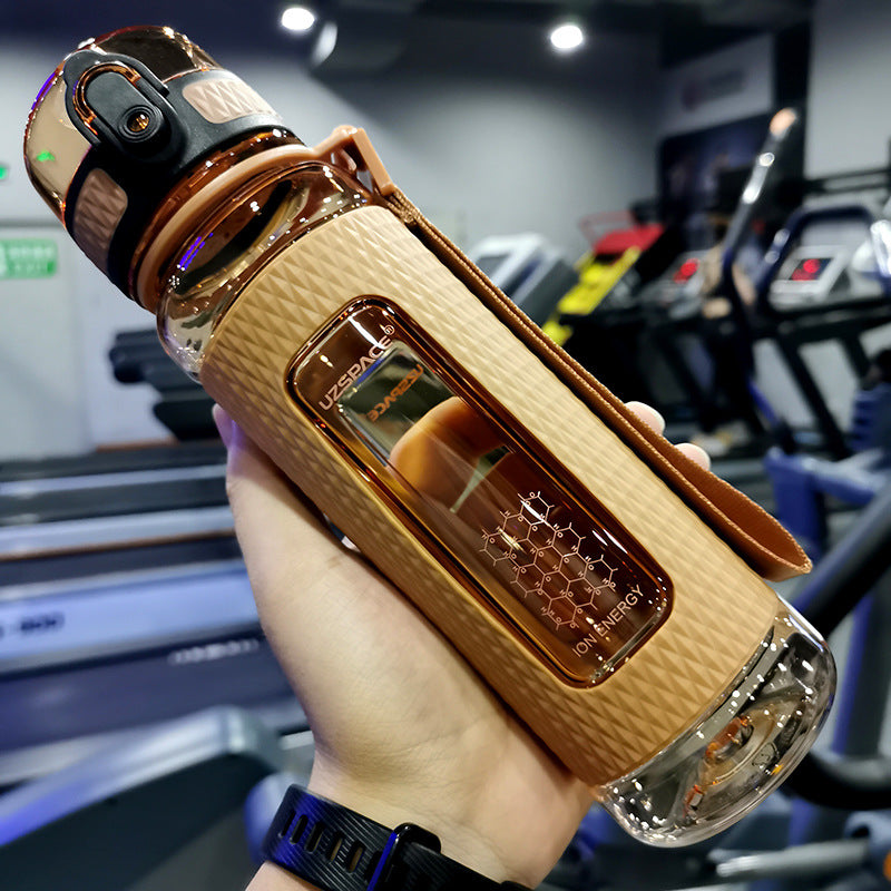 Portable sport water bottle in hand, made of copolymer polyester plastic, suitable for various temperatures.