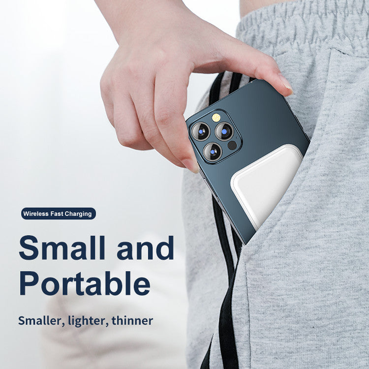 Mini Magnetic Power Bank 5000mAh Wireless being held and placed in a pocket, emphasizing its portable design.