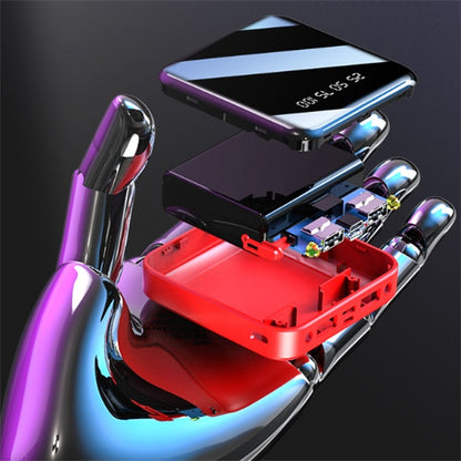 portable mirror power bank 20000 mAh disassembled showing internal components on a shiny hand
