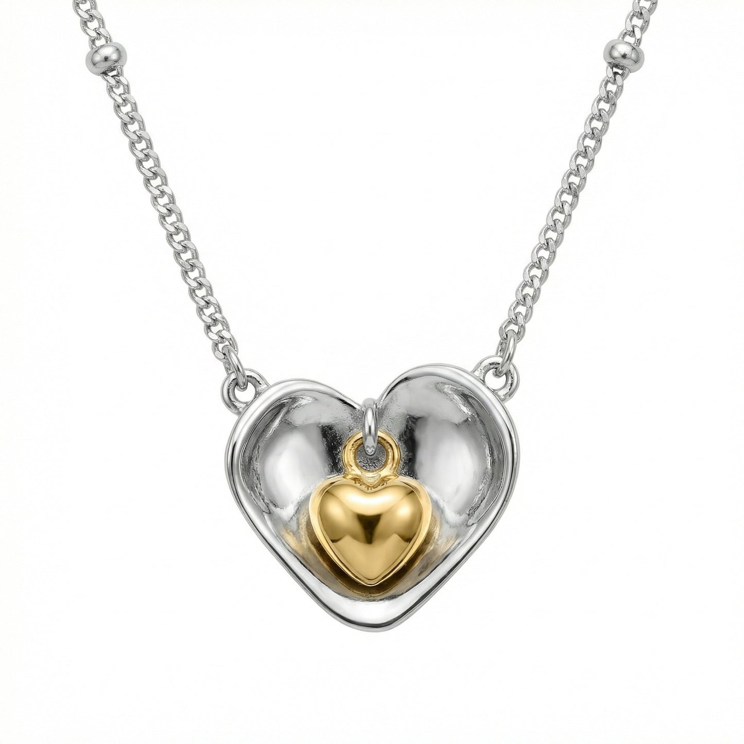 925 Sterling Silver nested heart pendant necklace showcasing a two-tone design with an inner gold heart.