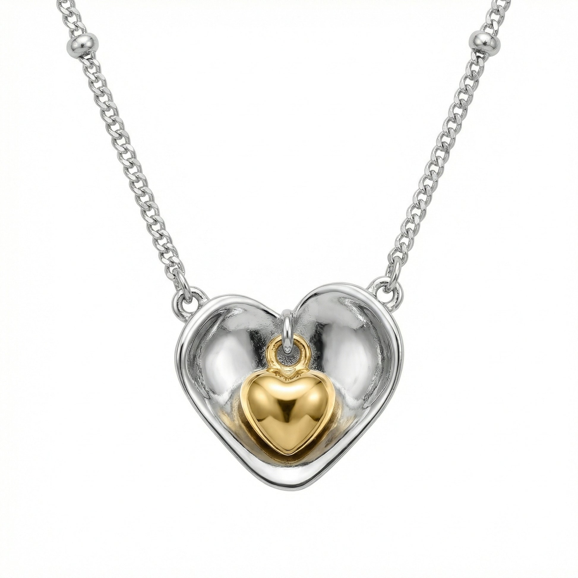 925 Sterling Silver nested heart pendant necklace showcasing a two-tone design with an inner gold heart.