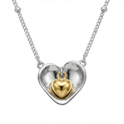 925 Sterling Silver nested heart pendant necklace showcasing a two-tone design with an inner gold heart.