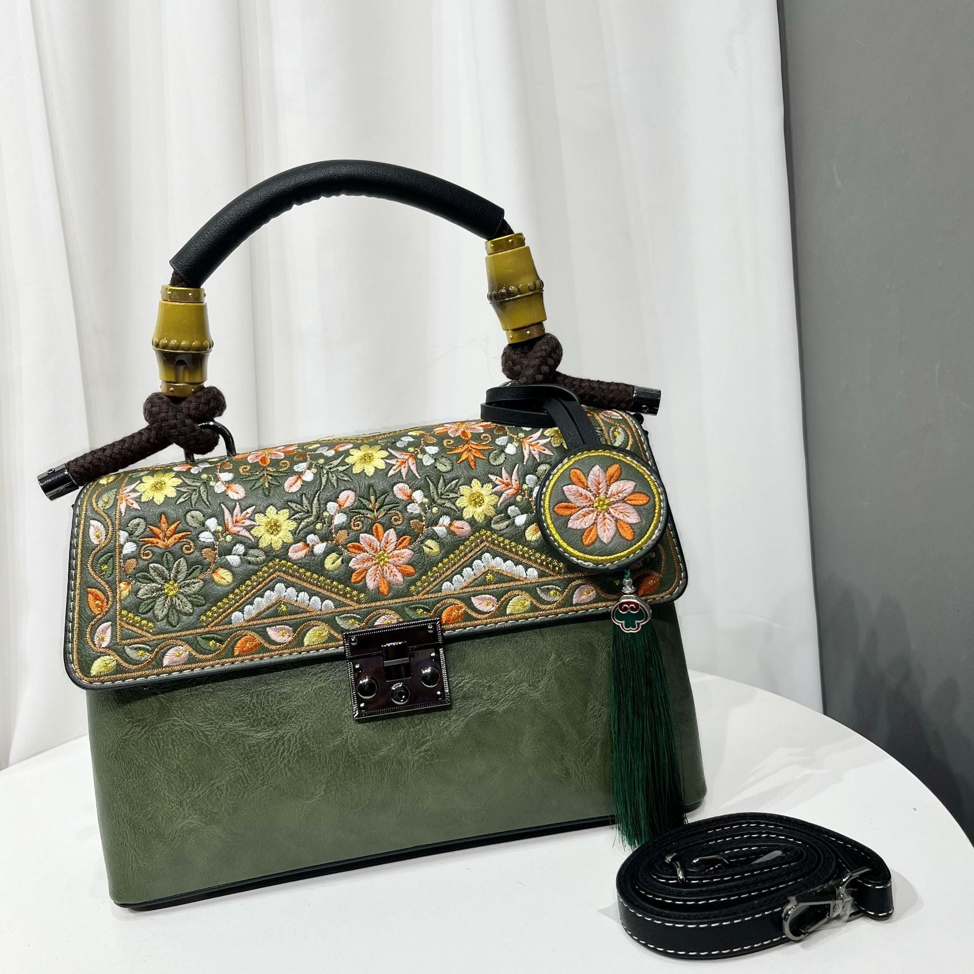 Large capacity casual bag for women with intricate floral embroidery and stylish design.