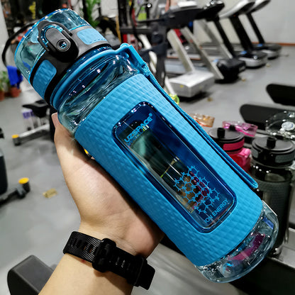 Portable sport water bottle in blue held in hand, ideal for sports use and high-temperature resilience.